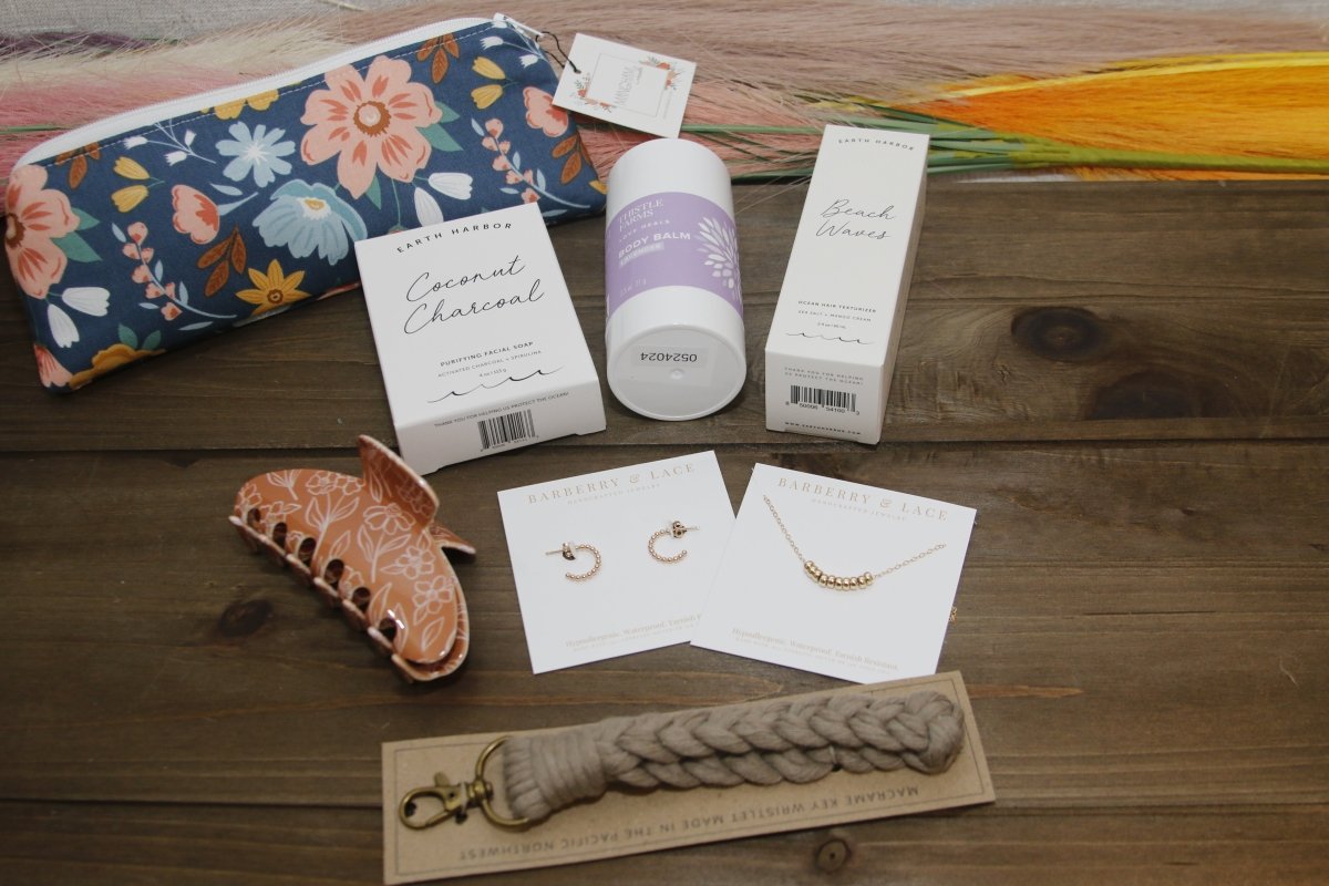 All About Her Gift Box - Organic & Eco Friendly Gift - Gift Box Daffodil & Alder Small boho floral pouch, body balm, earth harbor charcoal soap and beach waves texturizer, hypoallergenic hoop earrings and necklace, boho style claw clip and macrame wristlet. 